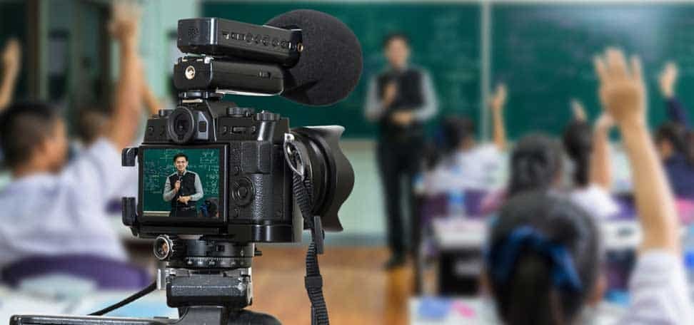 video camera recording a teacher in a classroom