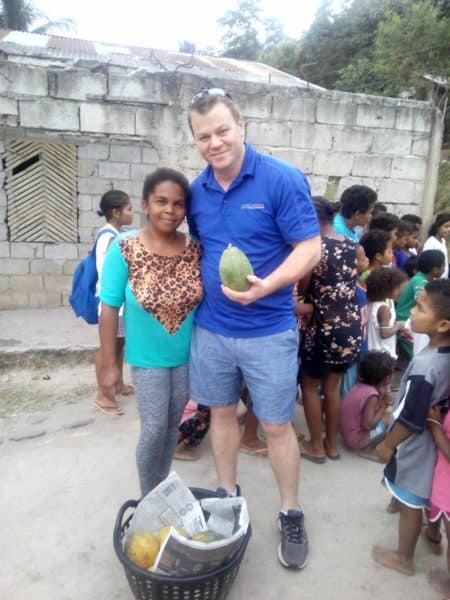Fruit distribution during MyOutDesk outreach event for the Aeta community