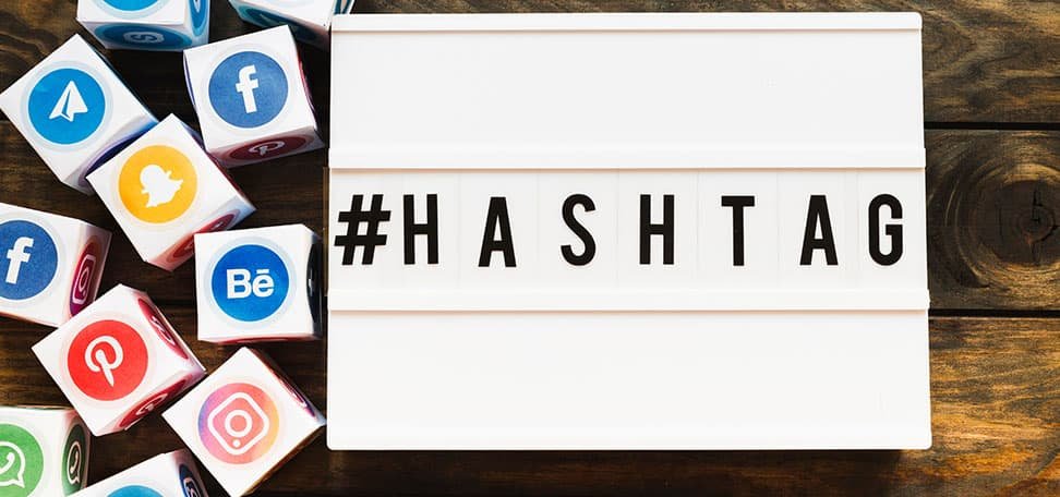 social media icons on blocks that #hashtag on a box