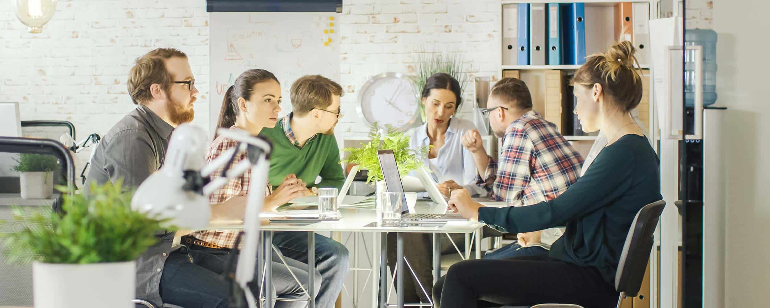 a team of marketers working together at a table