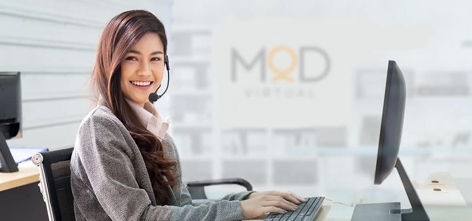 a happy myoutdesk real estate virtual assistant smiling