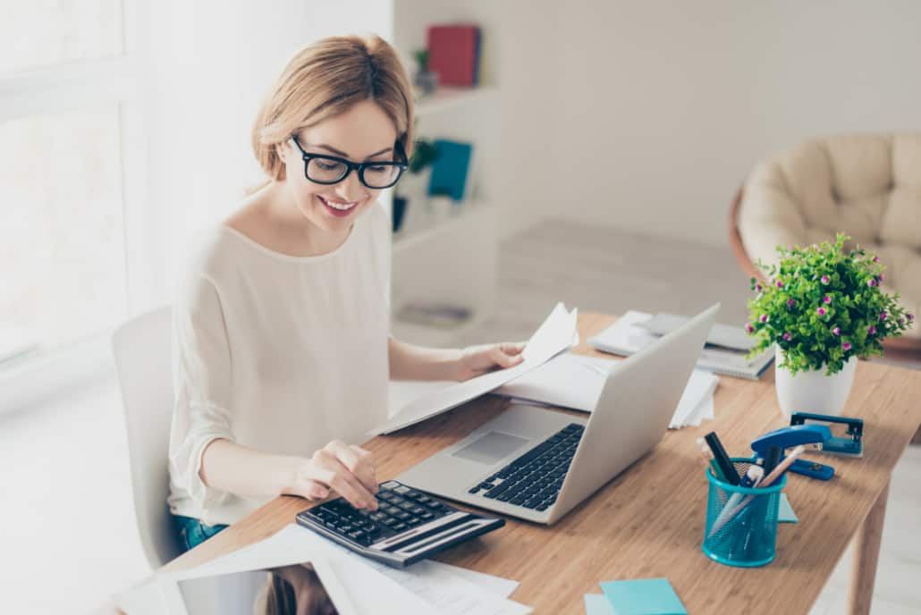 business owner working at desk comparing fiverr to upwork comparing freelance platforms