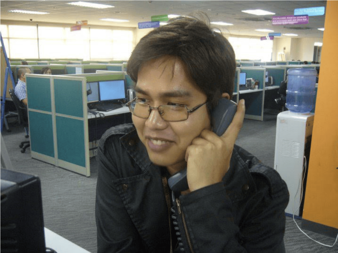 man talking on phone in office