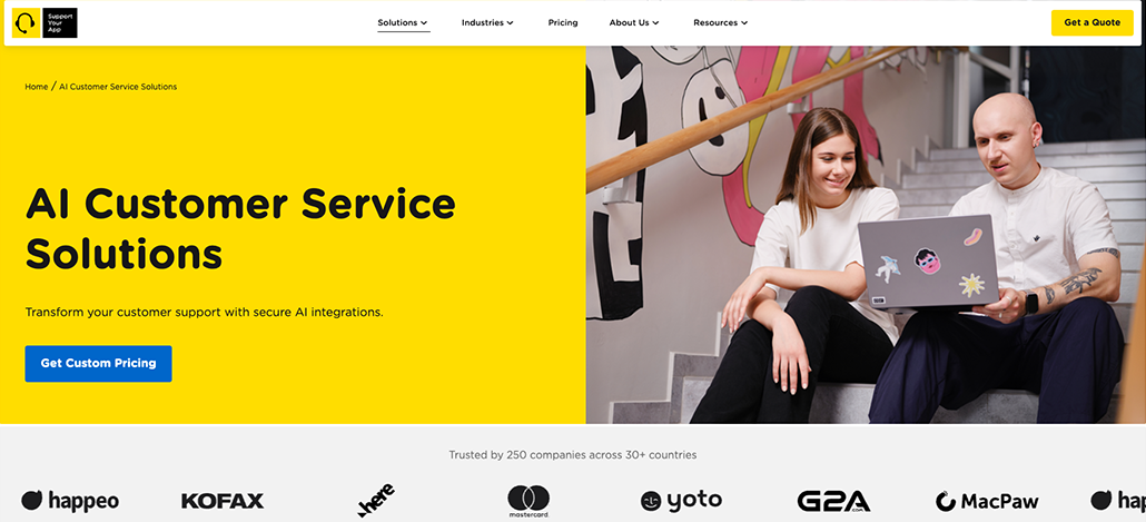 Two people sit on stairs, smiling at a laptop. On the left, text promotes AI customer service solutions and asks, “What is Customer Service Outsourcing?” A blue “Get Custom Pricing” button and several company logos appear below.