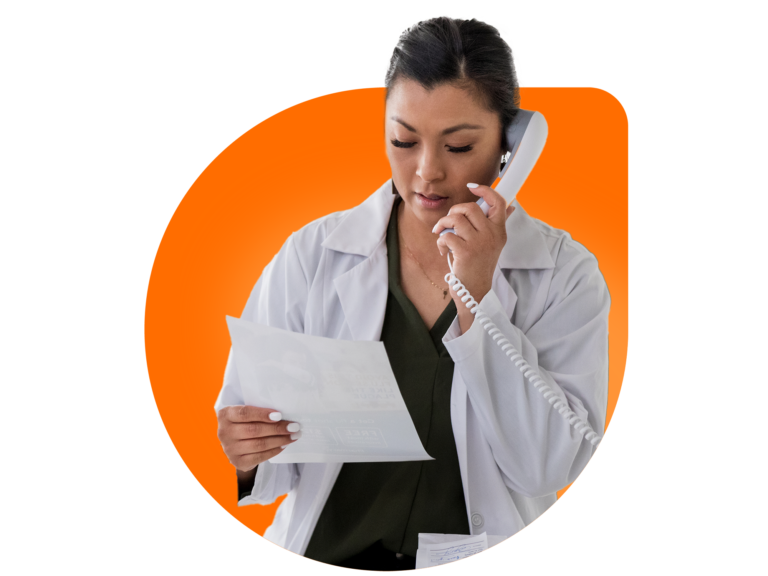 MyOutDesk - Healthcare VA Woman wearing lab coat on the phone while looking at a flier.